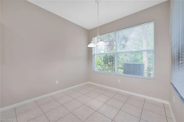 Breakfast area with tile floor adjacent to kitchen
