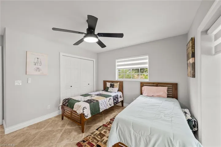 Bedroom with a closet and ceiling fan