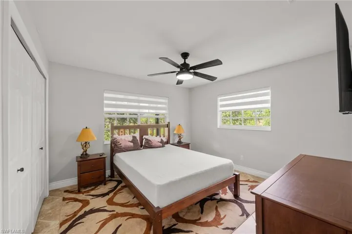 Bedroom featuring a closet and a ceiling fan