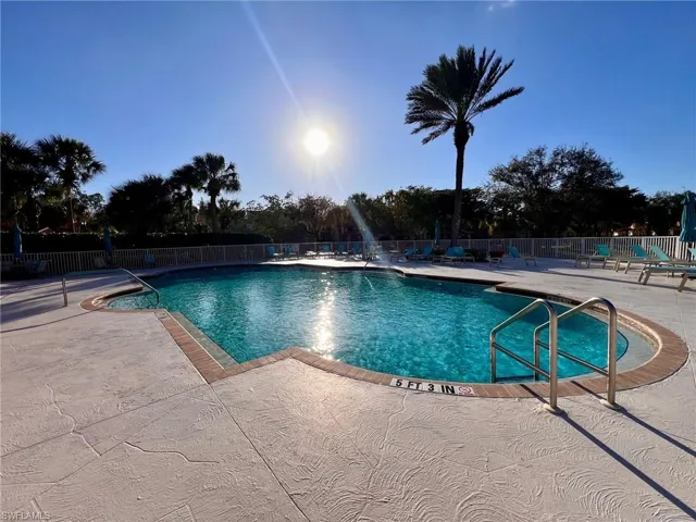 Community pool featuring a patio