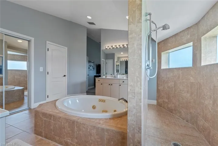 Primary bathroom w/walk-thru shower.