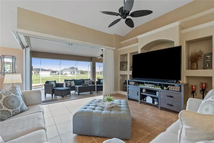 Open living room with 90-degree sliders.