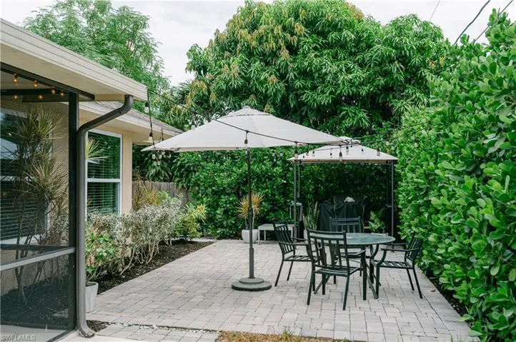 View of patio featuring outdoor dining space featuring Bistro lights, can easily make it your own!