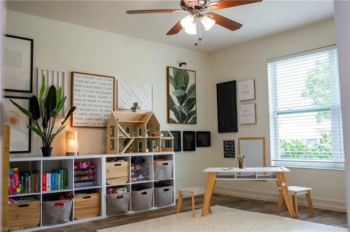Playroom with wood tile finished floors and ceiling fan
