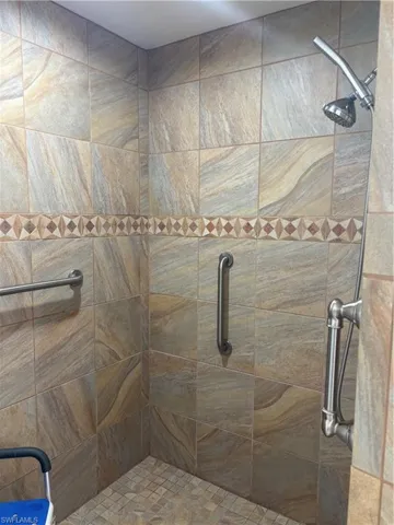 Full bathroom with a tile shower