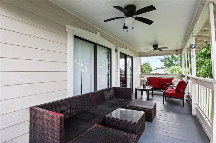 Deck with ceiling fan and an outdoor hangout area