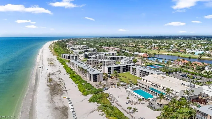 Aerial view of expansive coastline and a pool
