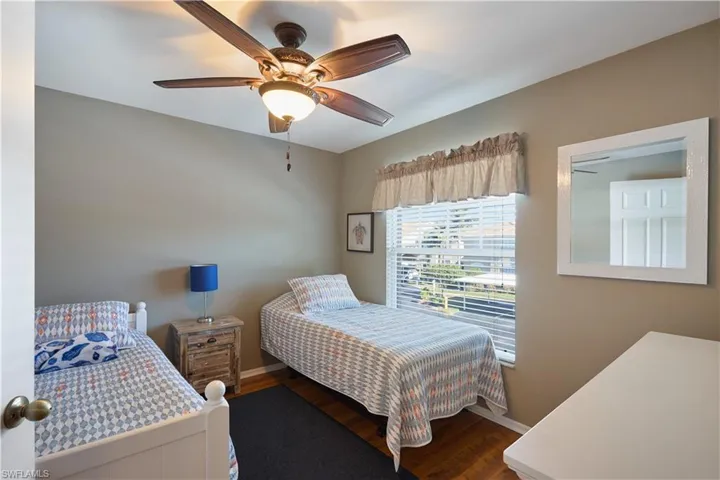Bedroom featuring ceiling fan and hardwood / wood-style floors