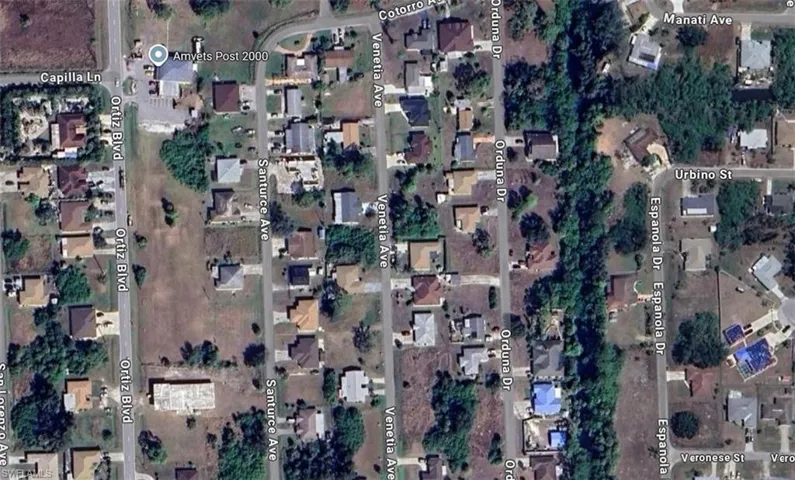 Aerial overview of property's location featuring nearby suburban area