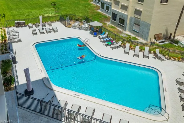 Community pool featuring a patio