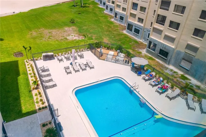Community pool with a patio