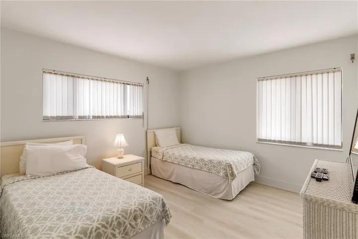 Bedroom featuring light wood-type flooring and baseboards