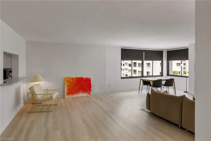 Living room featuring light wood-style floors and baseboards