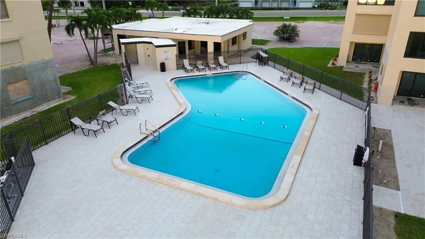 Community pool featuring a patio