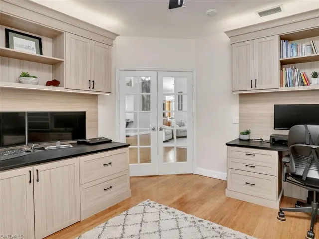 Laundry area featuring cabinets, washing machine and dryer, and sink