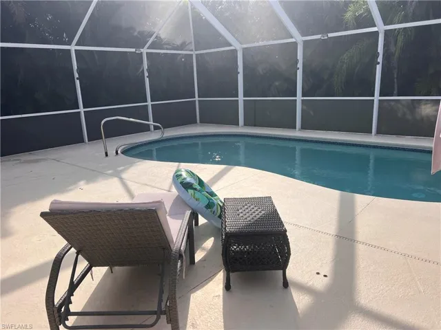 View of pool featuring a lanai and a patio