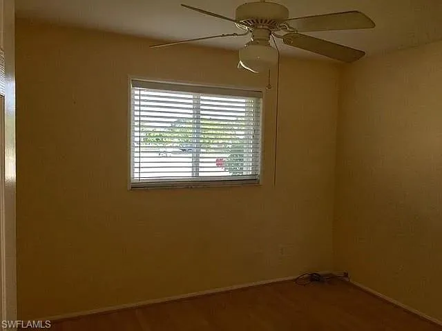 Guest room #2 featuring hardwood / wood-style flooring and ceiling fan
