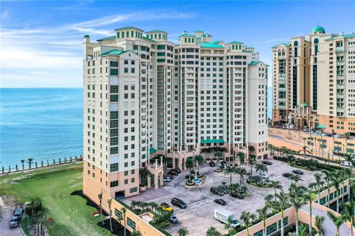 View of apartment building / complex featuring a water view