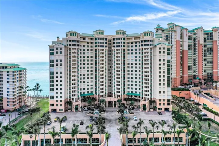 View of apartment building / complex featuring a water view