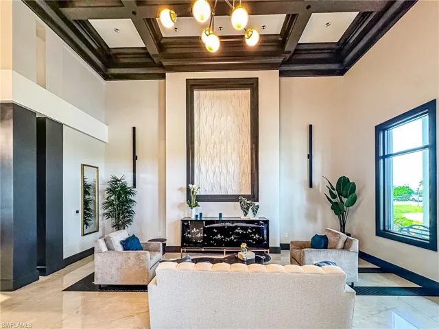Lobby featuring coffered ceiling and crown molding