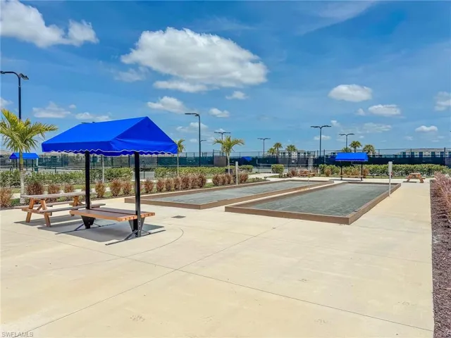 View of property's community with a bocce ball area