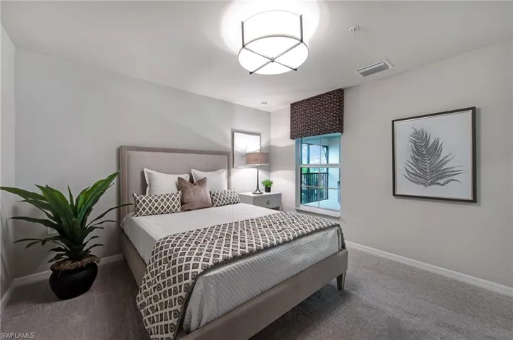 Bedroom with baseboards and carpet flooring