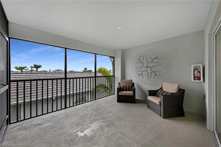 Living area with a textured wall and carpet