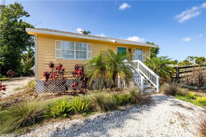 View of cottage and landscaping