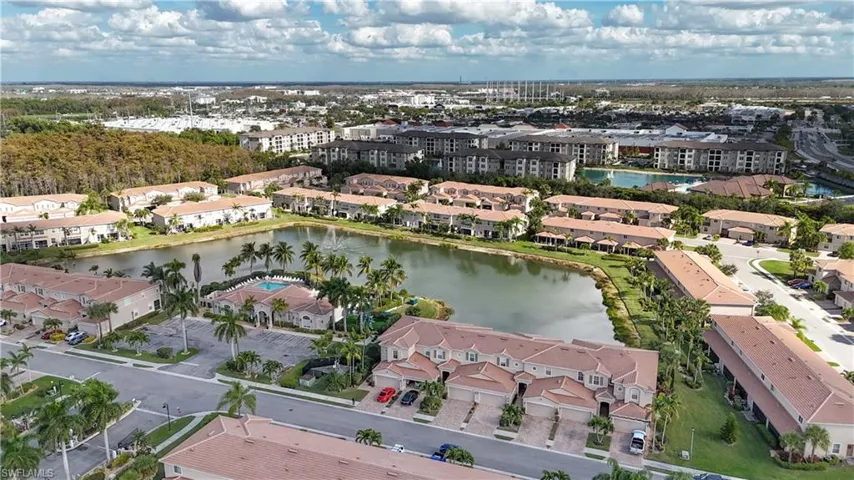 Aerial view of property's location with a large body of water