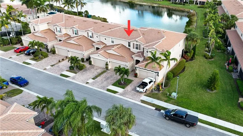 Aerial perspective of suburban area with a large body of water