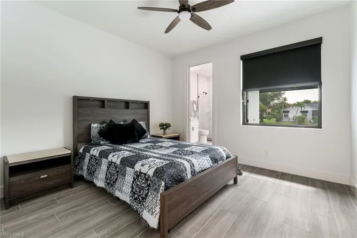 Bedroom with ensuite bath, and access to pool area