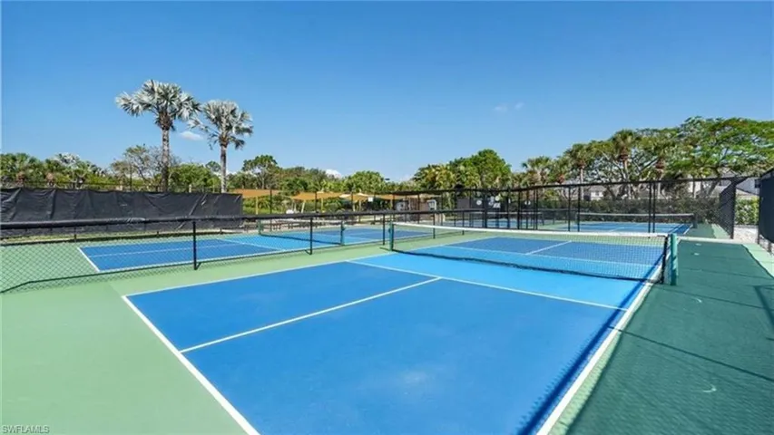 View of tennis court featuring community basketball court