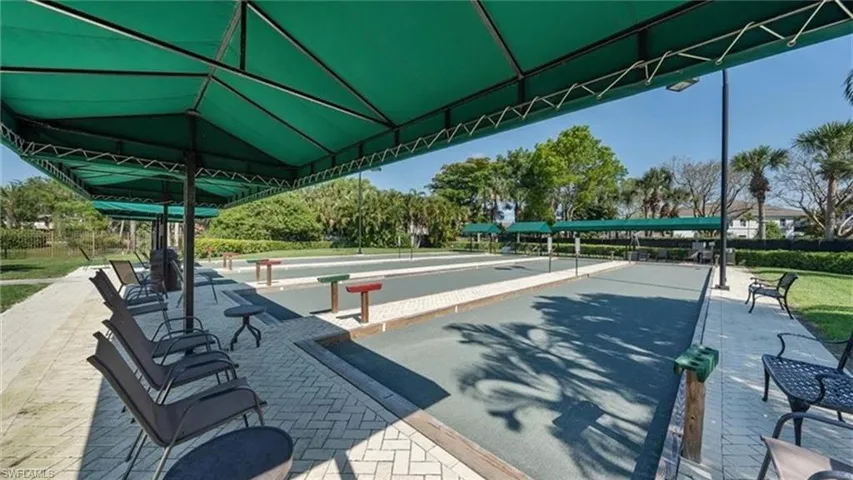 View of property's community with a bocce ball area