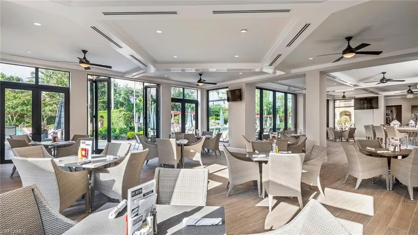 Community lobby featuring coffered ceiling, beamed ceiling, and recessed lighting