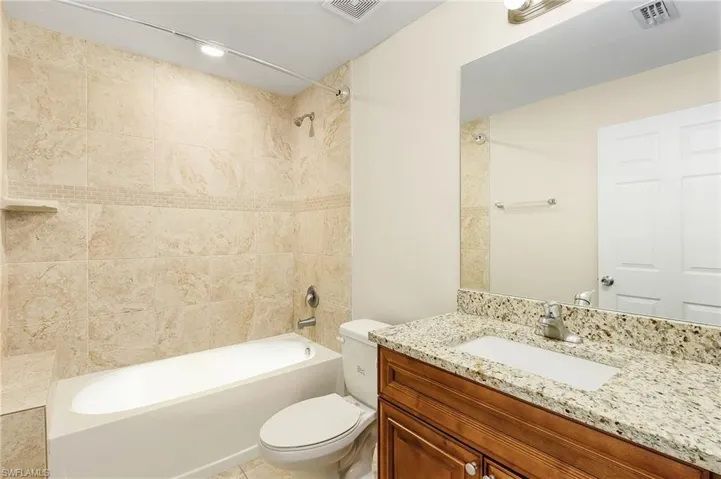 Full bathroom with vanity and shower / washtub combination