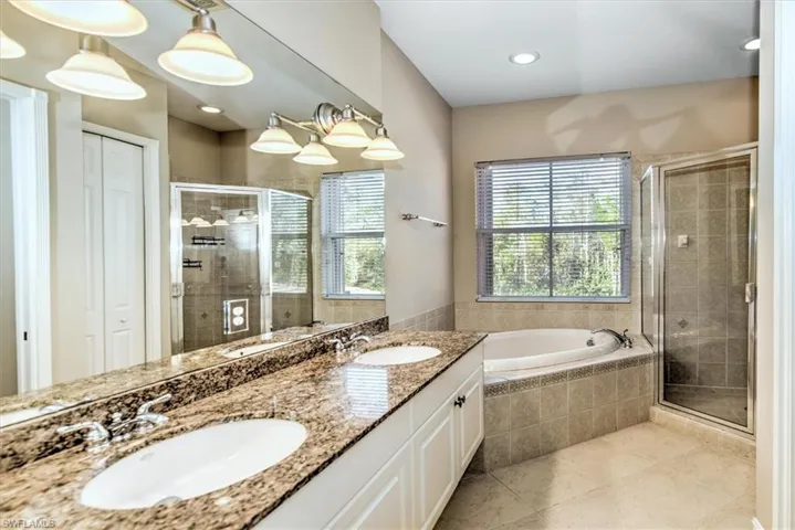 Main Bathroom with Soaking Tub, Shower and Dual Sink Vanity