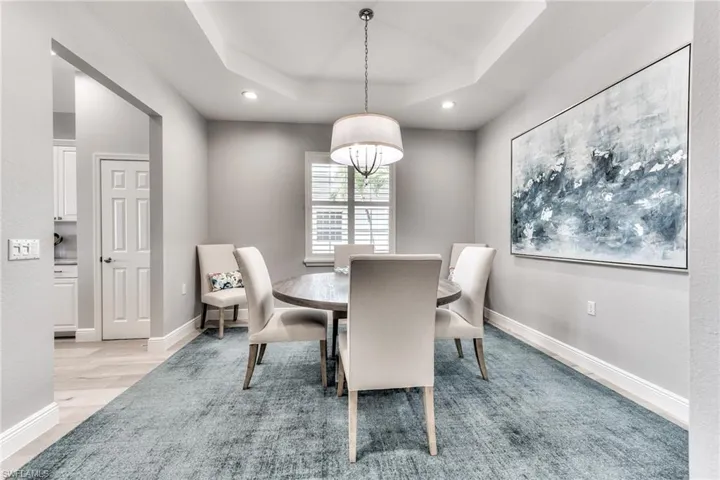 Dining area featuring a tray ceiling