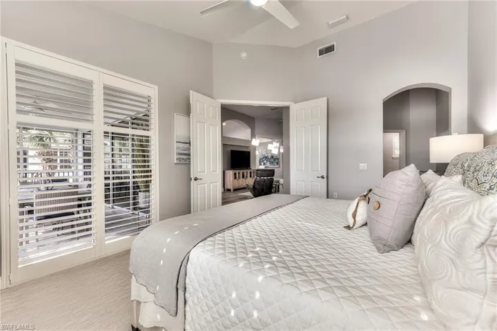 Carpeted bedroom with ceiling fan