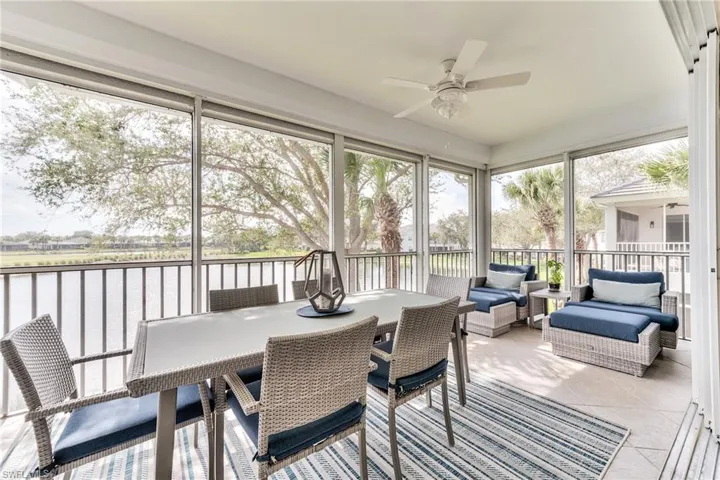 Sunroom / solarium featuring ceiling fan