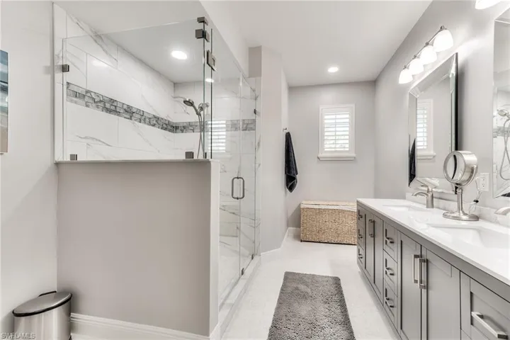 Bathroom featuring vanity and walk in shower