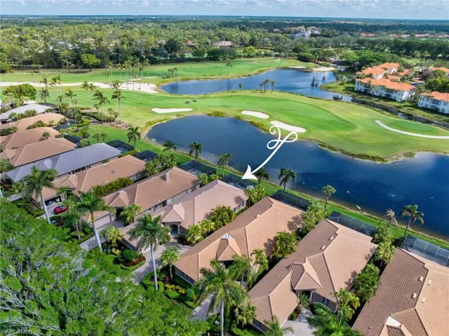 This home has views of the lake and the 8th Fairway of the Palm Course in Grey Oaks.