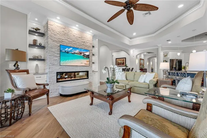 ...while the interior updates will stand the test of time, with a custom, stone entertainment wall and fireplace, which adds so much to the ambience of the room.