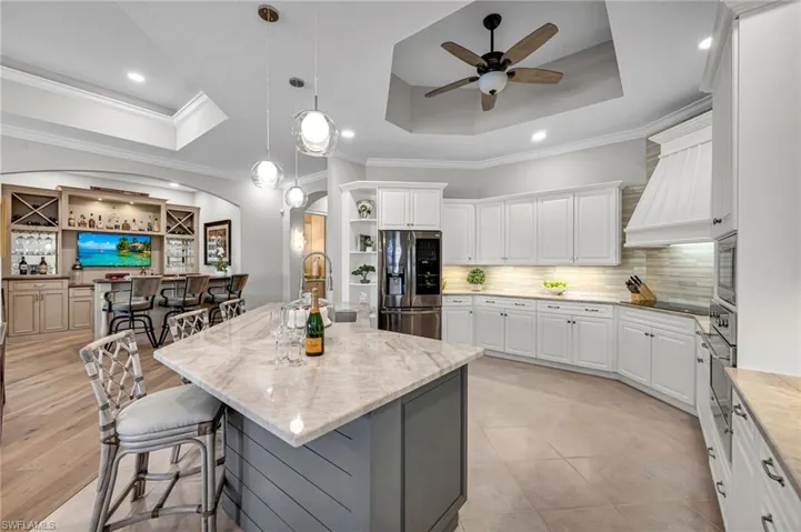 This large, cheery kitchen opens up to the bar and family room, and has amazing views!