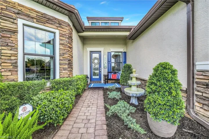 View of front exterior.  Elegant yet cozy private porch entry with a gorgeous view of a large lake and natural wildlife just outside your front door.
