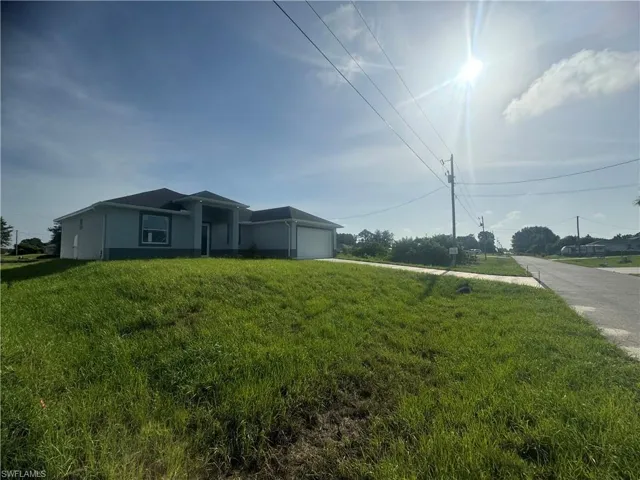 View of yard with a garage