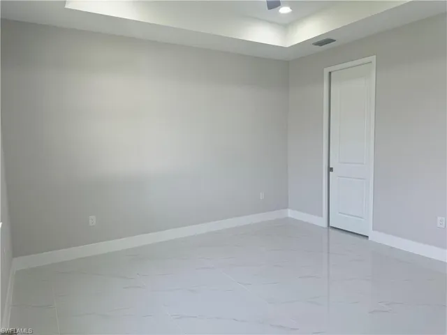 Spare room featuring light tile patterned floors