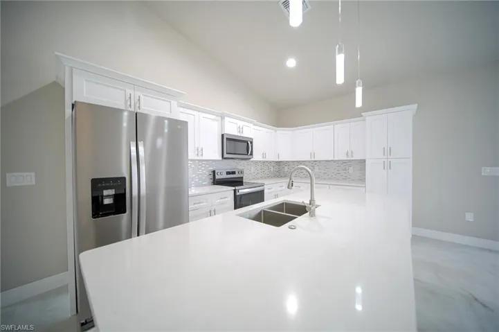 The Island Kitchen Comes With Quartz Countertops, Real Wood Flat Panel Cabinets & Drawers, A Floor To Ceiling Pantry, Brand New Stainless Steel Appliances, And A Tile Backsplash!