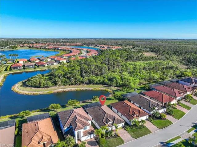 Aerial perspective of suburban area featuring a large body of water