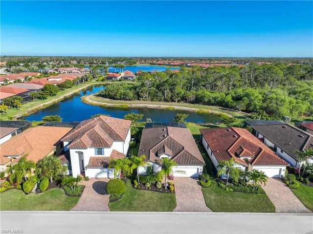 Aerial perspective of suburban area with a large body of water