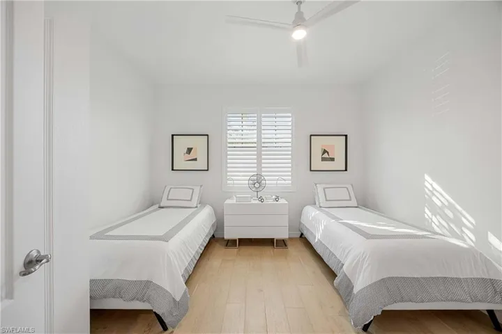 Bedroom featuring light wood finished floors and ceiling fan